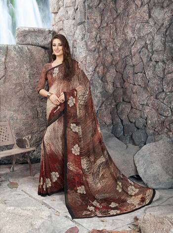 Enhance Your Beauty wearing This saree In Brown Color Paired With Brown Colored Blouse. This Saree And Blouse Are Fabricated On Georgette Beautified With Prints. It Is Durable And easy To Care For.