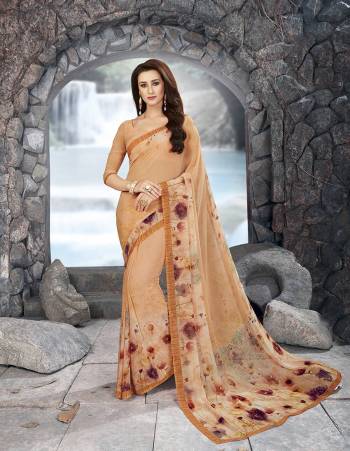 Here Is A Pretty Checks Printed Saree In Beige Color Paired With Beige Colored Blouse. This Saree And Blouse Are Fabricated On Georgette Beautfied With Floral Prints And Checks. Buy This Saree Now.