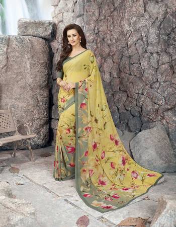 Go With The Shades Of Green Wearing This Saree In Pear Green Color Paired With Mint Green Colored Blouse. This Saree And Blouse Are Fabricated On Georgette Beautified With Floral Prints All Over It. Buy This Pretty Saree Now.