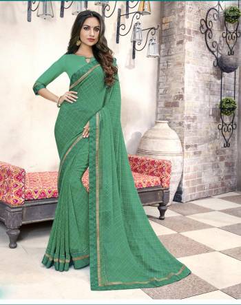 Go Green Wearing This Saree Simple Saree In Green Color Paired With Green Colored Blouse. This Saree And Blouse Are Fabricated On Georgette. It Also Ensures Superb Comfort As It Is Light In Weight.