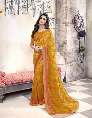 Here Is A Beautiful Saree In Musturd Yellow Color Paired With Musturd Yellow Colored Blouse. This Saree And Blouse are Fabricated On Georgette Which Is Light Weight And Easy To Carry All Day Long.