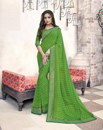 Go Green Wearing This Saree Simple Saree In Green Color Paired With Green Colored Blouse. This Saree And Blouse Are Fabricated On Georgette. It Also Ensures Superb Comfort As It Is Light In Weight.