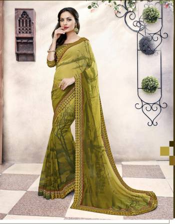 New And Unique Shade Of Green Is Here With This Saree In Olive Green Color Paired With Olive Green Colored Blouse. This Saree And Blouse Are Fabricated On Georgette Beautified With Prints All Over. 