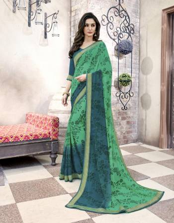 Cool Color Pallete Always Gives A Fresh Bright Look, Grab This Pretty Saree In Green And Blue Color Paired With Blue Colored Blouse. This Saree And Blouse Are Fabricated On Georgette Beautified With Floral Prints. 