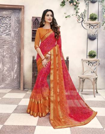 Orange And Red Color Induces Perfect Summery Appeal To Any Outfit, So Grab This Pretty Saree In Red And Orange Color Paired With Orange Colored Blouse. This Saree And Blouse Are Fabricated On Georgette Beautified With Prints. 