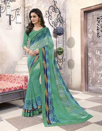 Go Green Wearing This Saree Simple Saree In Green Color Paired With Green Colored Blouse. This Saree And Blouse Are Fabricated On Georgette. It Also Ensures Superb Comfort As It Is Light In Weight.