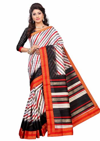 For A Simple, Rich And Elegant Look, Grab This Saree In White And Black Color Paired With Black Colored Blouse. This Saree And Blouse Are Fabricated On Art Silk Beautified With Prints And Lace Border. Buy This Saree Now.