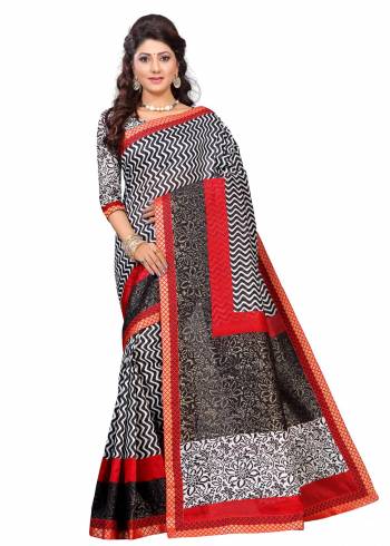 For A Simple, Rich And Elegant Look, Grab This Saree In Black And White Color Paired With White And Black Colored Blouse. This Saree And Blouse Are Fabricated On Art Silk Beautified With Prints And Lace Border. Buy This Saree Now.