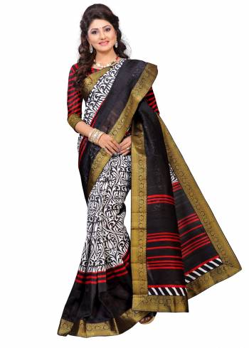 For A Simple, Rich And Elegant Look, Grab This Saree In Black And White Color Paired With Black & Red Colored Blouse. This Saree And Blouse Are Fabricated On Art Silk Beautified With Prints And Lace Border. Buy This Saree Now.