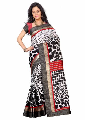 Enhance Your Beauty With This Evergreen Combination Of Saree In White And Black Color Paired With Red Colored Blouse. This Saree And Blouse Are Fabricated On Art Silk Beautified With Prints and Lace Border. This Saree Is Light Weight And easy To Carry All Day Long.