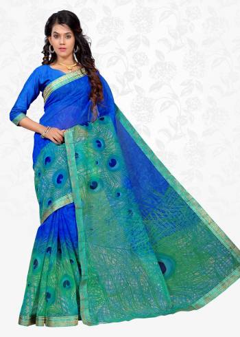 Grab This Cool Colored Pallete Saree In Blue And Sea Green Color Paired With Blue Colored Blouse. This Saree Is Fabricated On Cotton Silk Paired With Art Silk Fabricated Blouse. It Has Pretty Peacock Feather Prints All Over. Buy Now.