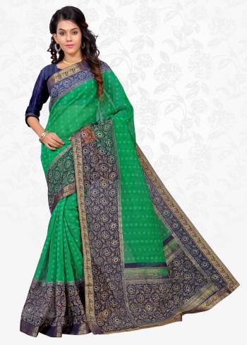 Simple Saree Is Here For Your Casual wear In Green Color Paired With Contrasting Navy Blue Colored Blouse. This Saree Is Fabricated On Cotton Silk Paired With Art Silk Fabricated Blouse. It Is Beautified With Prints All Over.