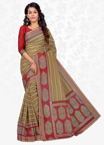 Rich And Simple Saree Is Here In Beige Color Paired With Contrasting Red Colored Blouse. This Saree Is Fabricated On Cotton Silk Paired With Art Silk Fabricated Blouse. This Saree Is Beautified With Prints And Lace Border. Buy Now.