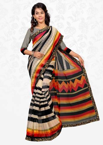 For Your Casual Wear, Grab This Pretty Simple Saree In Cream And Black Color Paired With Cream And Black Colored Blouse. This Saree Is Fabricated On Cotton Silk Paired With Art Silk Fabricated Blouse. It Has Very Simple Basic Prints All Over It.