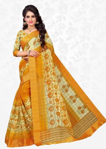 Celebrate This Festive Season Wearing This Saree In Musturd Yellow Color Paired With Cream And Yellow Colored Blouse. This Saree Is Fabricated On Cotton Silk Paired With Art Silk Fabricated Blouse. It Has Checks And Floral Prints Over The Saree.