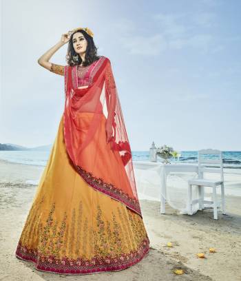 Another Colorful Designer Lehenga Choli Is Here In Pink And Yellow Colored Blouse Paired With Yellow Colored Lehenga And Contrasting Red Colored Dupatta. Its Blouse And Lehenga Are Fabricated On Art Silk Paired With Net Fabricated Dupatta. It Has Beautiful Attractive Embroidery All Over The Lehenga And Choli With Embroidered Lace Border Over Dupatta.