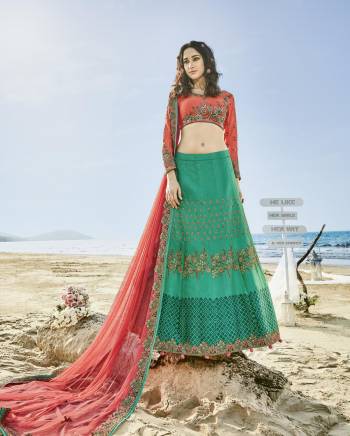 Add This Designer Lehenga Choli To Your Wardrobe With This Pretty Color In Dark Peach Colored Blouse Paired With Contrasting Sea Green Colored Lehenga And Dark Peach Colored Dupatta. Its Blouse Is Fabricated On Satin Silk Paired With Art silk Lehenga And Net Dupatta. All Its Fabrics Ensures Superb Comfort Throughout The Gala. Buy Now.