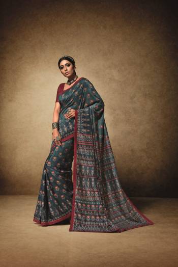 Add This New Shade To Your Wardrobe With This Saree In Prussian Blue Color Paired With Contrasting Maroon Colored Blouse. This Saree Is Fabricated On Tussar Art Silk Paired With Art Silk Fabricated Blouse. It Is Pretty Small Prints All Over The Saree. Buy Now.