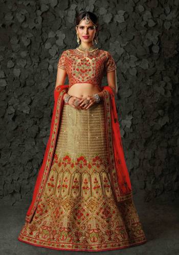 Grab This Beautiful Designer Heavy Lehenga Choli In Red Colored Blouse Paired With Beige Colored Lehenga And Red Colored Dupatta. Its Blouse and Lehenga Are Fabricated On Art Silk Paired With Net Fabricated Dupatta. It Has Heavy Embroidery All Over The Attire. Buy Now.