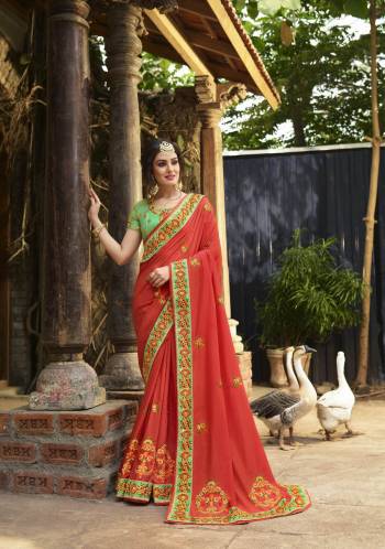 Orange Color Induces Perfect Summery Appeal To Any Outfit, So Grab This Saree In Light Orange Color Paired With Contrasting Light Green Blouse. This Saree And Blouse Are Fabricated On Art Silk Beautified With Heavy Contrasting Embroidery All Over. Buy This Saree Now.