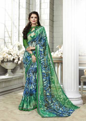 Cool Colors Alwas Gives A Fresh Look To Your Personality. Grab This Printed Saree In Blue And Green Color Paired With Green Colored Blouse. This Saree Is Fabricated On Georgette Paired With Art Silk Fabricated Blouse. It Is Beautified With Abstract Prints All Over. 