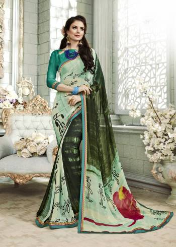 Go With The Shades Of Green wearing This Saree In Pastel Green And Pine Green Color Paired With Teal Green Colored Blouse. This Saree Is Fabricated On Georgette Paired With Art Silk Fabricated Blouse Beautified With Some Unique Prints. 