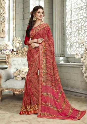 Adorn The Pretty Angelic Look Wearing This Saree In Red And Multi Color Paired With Red Colored Blouse. This Saree Is Fabricated On Georgette Paired With Art Silk Fabricated Blouse. It Is Beautified With Prints. Buy This Saree Now.