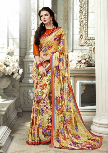 For Your Casual Or Semi-Casual Wear, Grab This Pretty Saree In Yellow And Multi Color Paired With Contrasting Orange Colored Blouse. This Saree Is Fabricated On Georgette Beautified With Floral Prints All Over It Paired With Art Silk Fabricated Blouse. Buy Now.