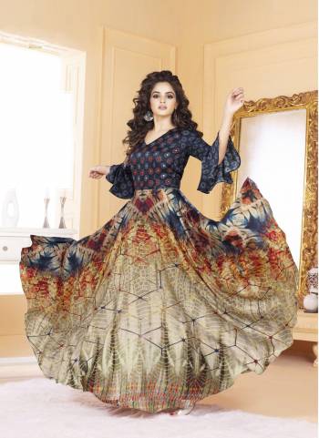 Grab This Beautiful Sleeve And Yoke Patterned Readymade Gown In Blue And Multi Color. It Is Fabricated On Tussar Art Silk Beautfiied Digital Prints And Thread Work. This Gown Is Available In Many Sizes. Buy Now.