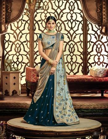 Bring out your gilded desires and adorn this gorgeously chic and elegant lehenga In Shades Of Blue, adorned with hanging bugle beads that?s going to make you look admirable. 