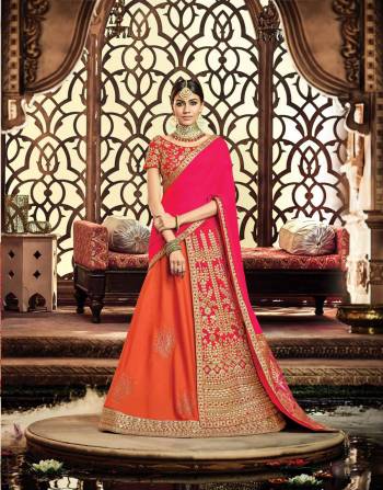 Make way for this queenly trend that's all set to make your regal soul satisfied With This Dark Pink And Orange Colored Lehenga. Pair the gota-enhanced lehenga with traditional jewelry and maangtika for an ethereal look. 