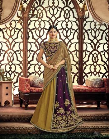 Appear like a true state of grace in this earthy and regal color combined two-layered lehenga In Purple And Olive Green Color. Adorn it with a traditional choker necklace to uplift the look. 