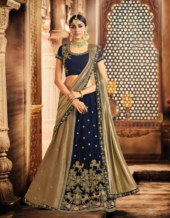 Weave a tale of grandeur in this navy blue lehenga bedecked with galloping horse motifs that's sure to take your ethnic-fashion game multiple notch higher. 