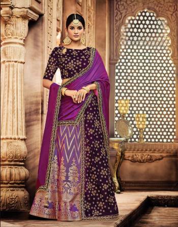 Fabulously feminine and eternally graceful, this royal Wine And Purple Colored lehenga is a sight to behold. Personlify the queenly side of you by adding a maharani style maangtika to your look. 