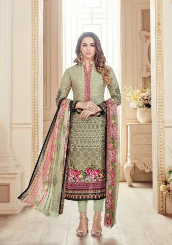 Flaunt Your Rich And Elegant Taste Wearing This Suit In Cream Colored Top Paired With Pastel Green Colored Bottom And Multi Colored Dupatta. Its Top And Bottom Are Fabricated On Cotton Paired With Chiffon Dupatta. It Is Beautified With Digital Prints And Thread Work.