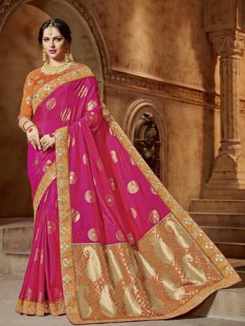 All the Fashionable women will surely like to step out in style wearing this Rani  pink color two tone silk jacquard pallu and two tone silk saree. this gorgeous saree featuring a beautiful mix of designs. look gorgeous at an upcoming any occasion wearing the saree. Its attractive color and designer embroidered design, stone, beautiful floral design work over the attire & contrast hemline adds to the look. Comes along with a contrast unstitched blouse.