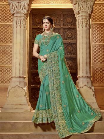 Presenting This Teal green color two tone silk saree. look gorgeous at an upcoming any occasion wearing the saree. this party wear saree won't fail to impress everyone around you. Its attractive color and designer embroidered design, patch design, stone, beautiful floral design work over the attire & contrast hemline adds to the look. Comes along with a contrast unstitched blouse.