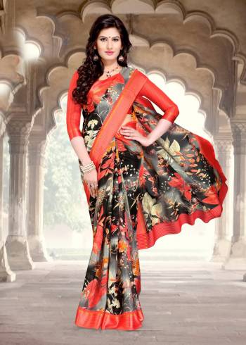 For A Unique Look, Grab This Saree In Grey And Black Color Paired With Orange Colored Blouse. This Saree And Blouse Are Fabricated On Chanderi Cotton Beautified With Floral Prints All Over It. Buy This Saree Now.