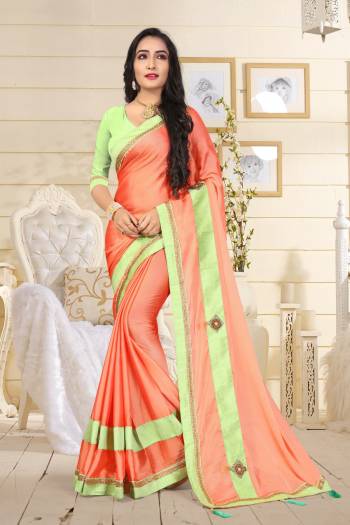 This Summer, Adorn A Beautiful And Attractive Look wearing This Saree In Light Orange Color Paired With Contrasting Light Green Colored Blouse. This Saree Is Fabricated On Satin Silk Paired With Art Silk Fabricated Blouse. Buy Now.