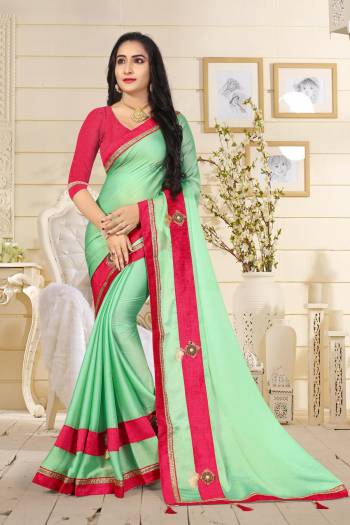 Here Is A Very Pretty Shade In Green With This Saree In Sea Green Color Paired With Contrasting Dark Pink Colored Blouse. This Saree Is Fabricated On Satin Silk Paired With Art Silk Fabricated Blouse. Both Its Fabrics Are Light Weight And Easy To Carry All Day Long.