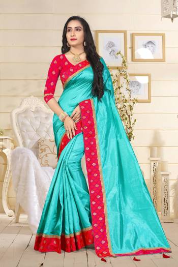 Attractive Shade In Blue Is Here With This Saree In Turquoise Blue Color Paired With Contrasting Dark Pink Colored Blouse. This Saree Is Fabricated On Art Silk Paired With Jacquard Silk Fabricated Blouse. Its Fabrics Are Light Weight And Easy to Carry Throughout The Gala.