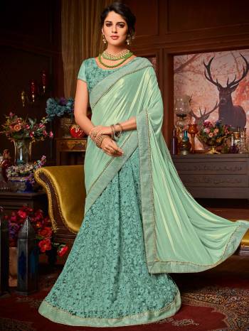 All the Fashionable women will surely like to step out in style wearing this Aqua Blue color Imported coated fabrics & diamond Net fabrics with Heavy work & jacquard border saree. this gorgeous saree featuring a beautiful mix of designs. look gorgeous at an upcoming any occasion wearing the saree. Its attractive color and designer embroidered saree, moti line border, stone, heavy designer blouse and beautiful floral design work over the attire & contrast hemline adds to the look. Comes along with a contrast unstitched blouse.