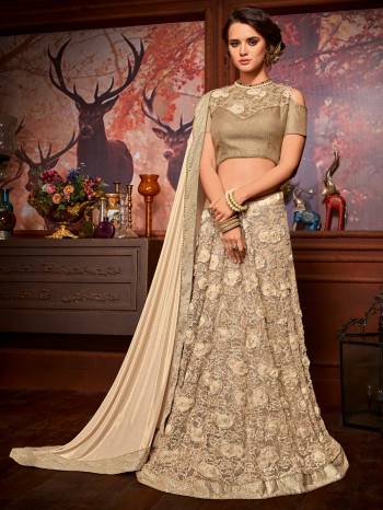 Flaunt a new ethnic look wearing this beige color Imported coated fabrics & diamond Net fabrics with Heavy work & jacquard border saree. Ideal for party, festive & social gatherings. this gorgeous saree featuring a beautiful mix of designs. Its attractive color and designer embroidered saree, moti line border, stone, heavy designer blouse and beautiful floral design work over the attire & contrast hemline adds to the look. Comes along with a contrast unstitched blouse.