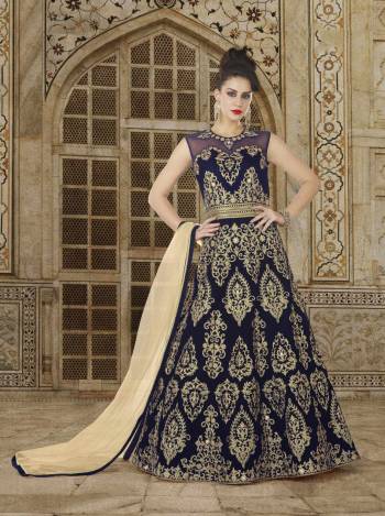 Enhance Your Beauty In This Designer Floor Length Suit In Navy Blue Color Paired With Navy Blue Colored Bottom And Beige Colored Dupatta. Its Top IS Fabricated On Velvet Paired With Santoon Bottom And Net Dupatta. Buy This Designer suit Now.