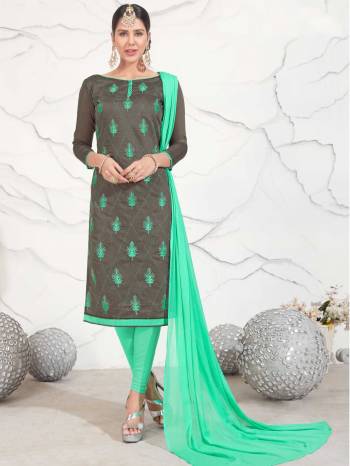 Flaunt Yout Amazing Rich Taste Wearing This Straight Cut Suit In Dark Grey Color Paired With Contrasting Sea Gren Colored Bottom And Dupatta. Its Top Is Fabricated On Chanderi Cotton Paired With Cotton Bottom And Chiffon Dupatta. Get This Dress Material Stitched As Per Your Regular Comfort.