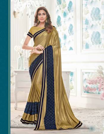 Bright And Visually Appealing, Grab This Gold , Blue Colored Saree Paired With Contrasting Gold Colored Blouse. This Saree Is Fabricated On Lycra Paired With Raw Silk Fabricated Blouse.This Saree Will Keep You Comfortable. Get It Now 