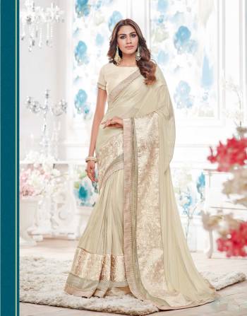 Adorn The Lovely Angelic Look With This Off White Colored Saree Paired With Off White Colored Blouse.This Saree Is Made From  Lycra Paired With Raw Silk Fabricated Blouse.Buy It Now.