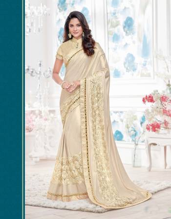 Here Is A Every Womens Favourite Colored Attire. Grab This Cream Colored Saree Paired With Cream Colored Blouse.This Saree Is Fabricated On Lycra Paired With Raw Silk Fabricated Blouse.Buy It Now.