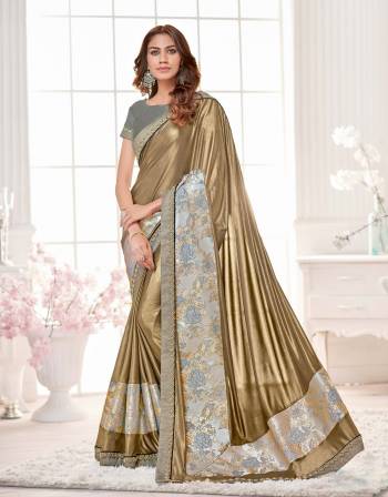 Add This New Combination Of Golden Colored Saree Paired With Grey Colored Blouse. This Saree Is Fabricated On Lycra Paired With Dupion Silk Fabricated Blouse.This Saree Will Keep You Comfortable. Get It Now.