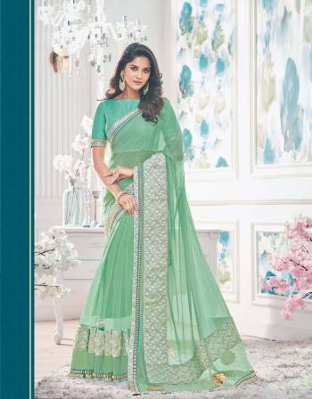 Aqua Green Is The Color Of Harmony, Grab This Aqua Green Colored Saree Paired With Contrasting Aqua Green Colored Blouse.  This Saree Is Fabricated On Lycra Net Paired With Raw Silk Fabricated Blouse. It Is Soft Towards Skin And Easy To Carry All Day Long.Get It Now.